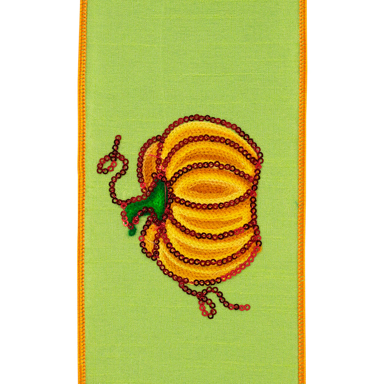4 inch citrus green wired ribbon featuring a sequined yellow pumpkin with red and green accents.