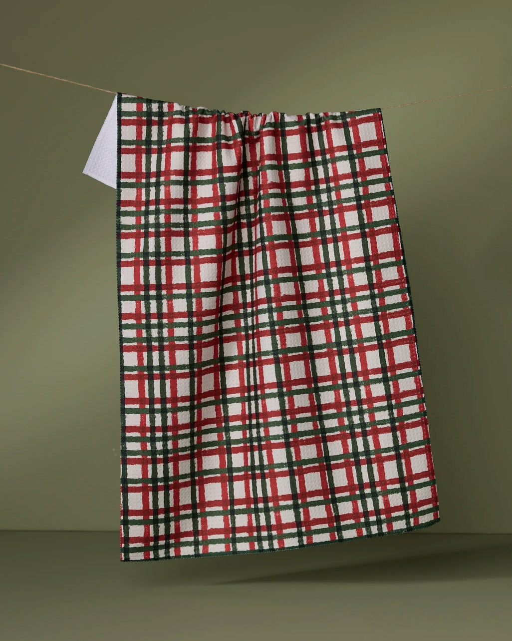 Waffle weave kitchen tea towel in holiday print with single-sided pattern.
