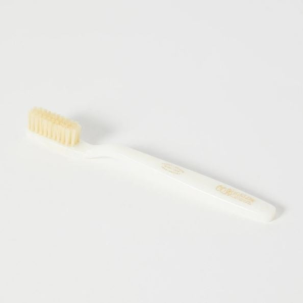 Natural boar bristle toothbrush with medium density ivory handle