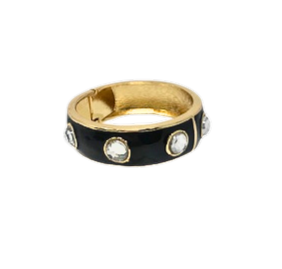 Gold plated hinged bangle bracelet with black enamel and circular crystal accents.