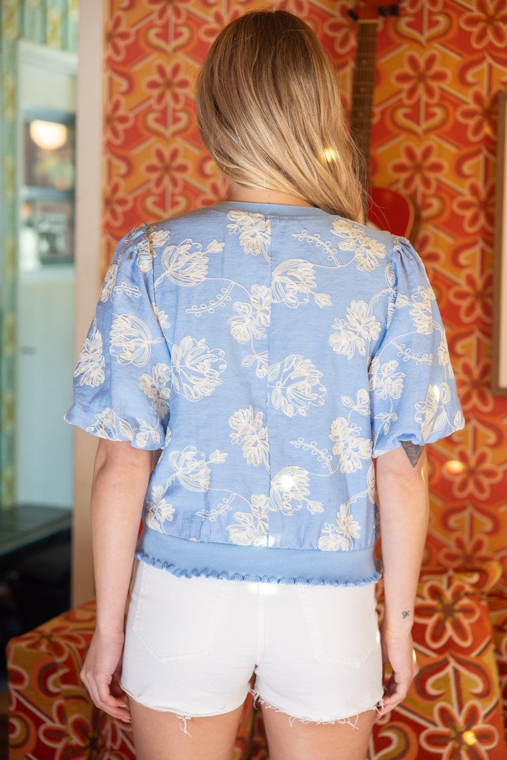 Scarlett floral embroidered top with bubble sleeves, ribbed bands, round neckline, and woven fabric in a small size.
