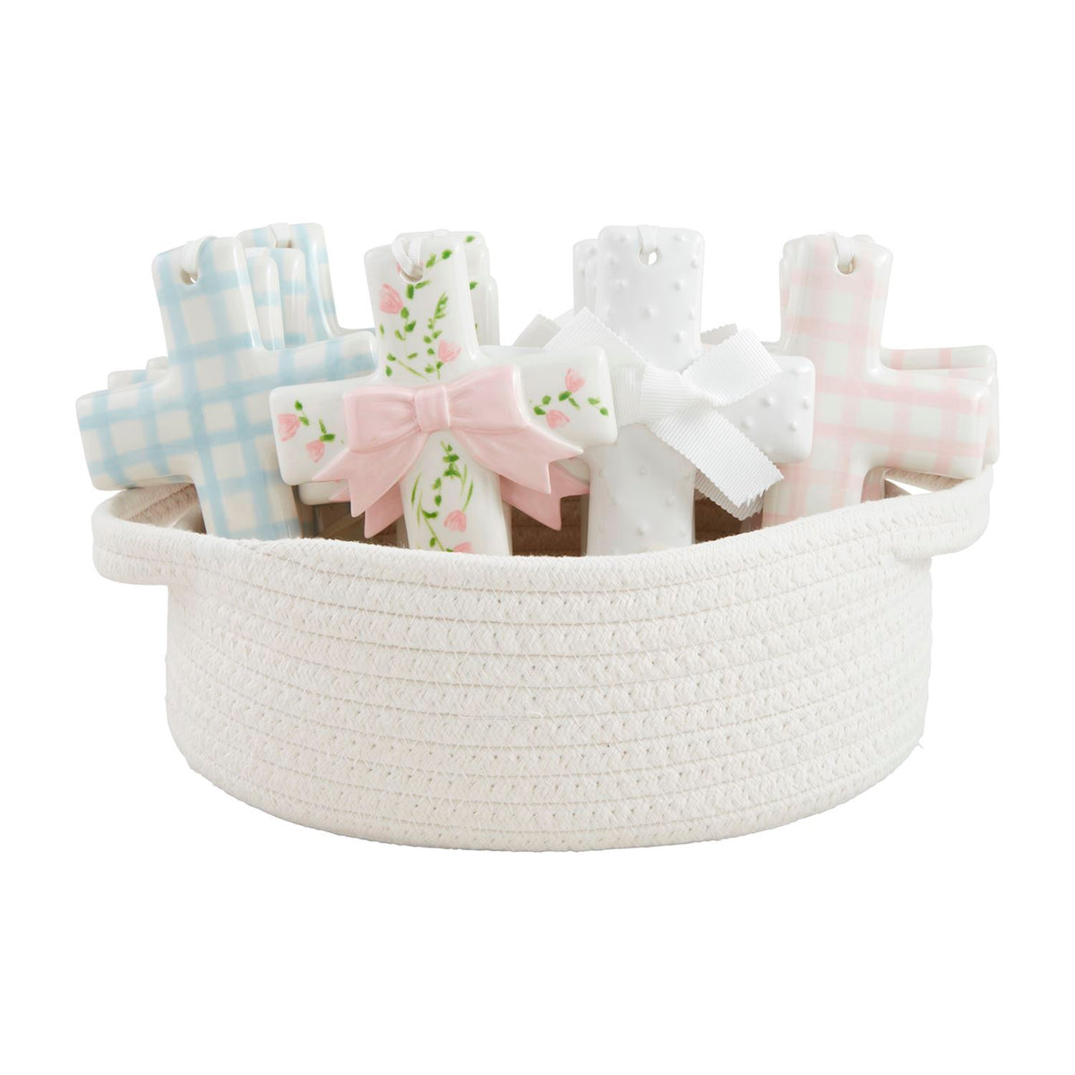 Assorted ceramic crosses with blue and pink patterns in a white woven rope basket.