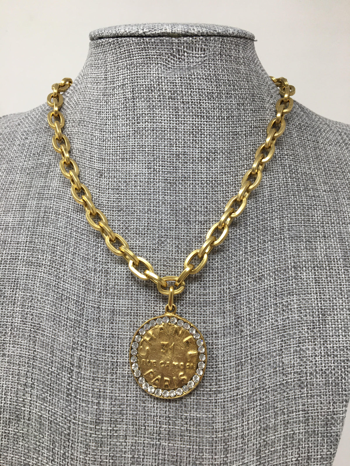 8.5-inch gold link chain featuring a Chanel-style coin pendant with rhinestones