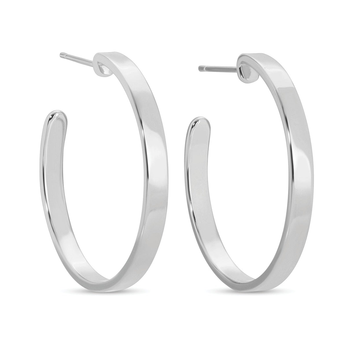 Pair of silver-toned flat hoop earrings with a 1.2-inch drop and post back closures.