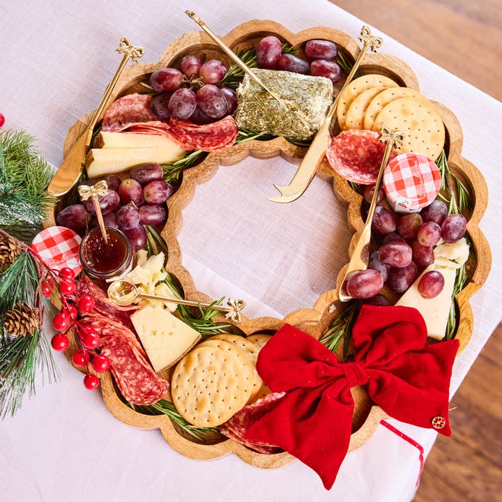 Reversible magnetic serving board with festive bow attachment