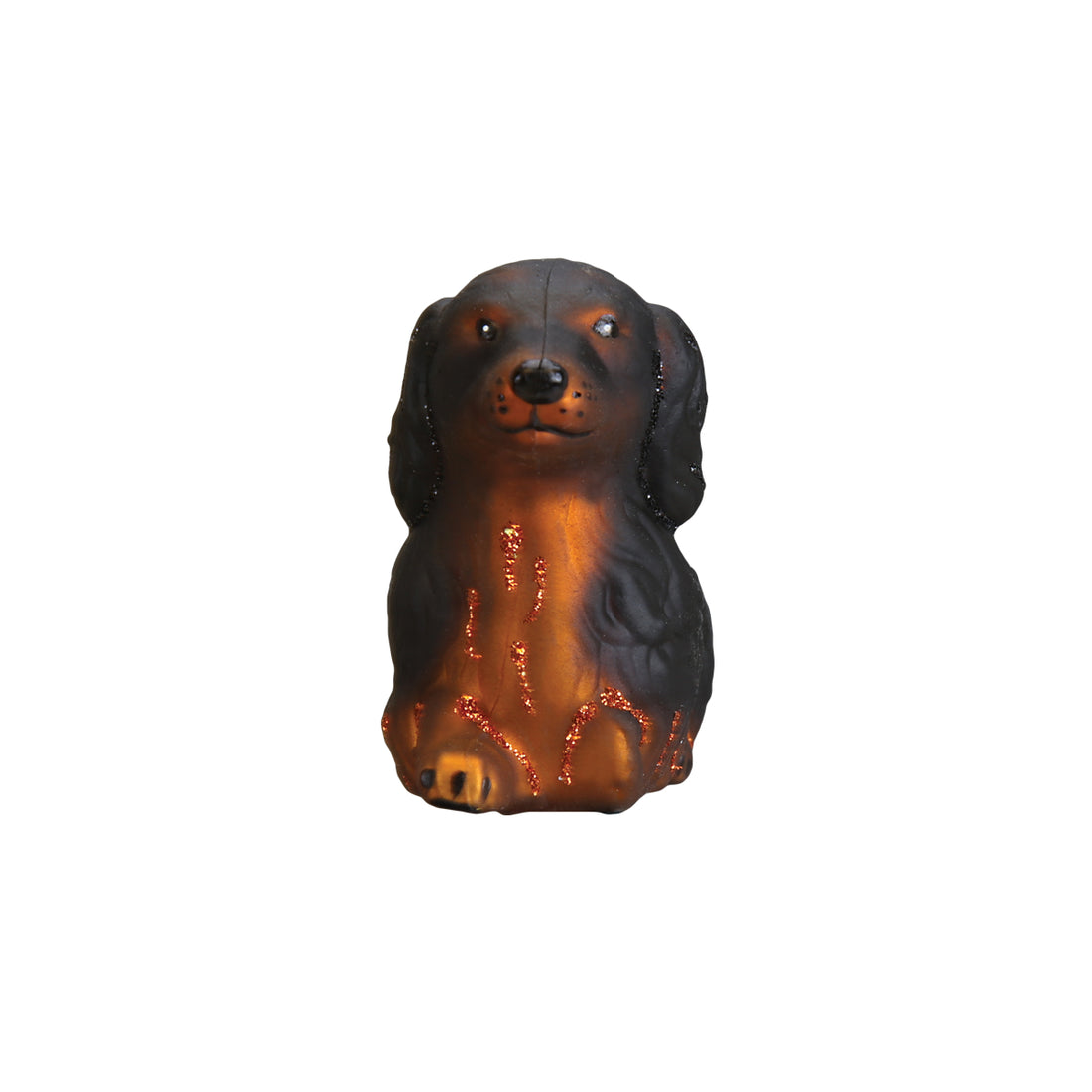 Long-haired Dachshund glass ornament with black and brown fur and orange glitter accents.