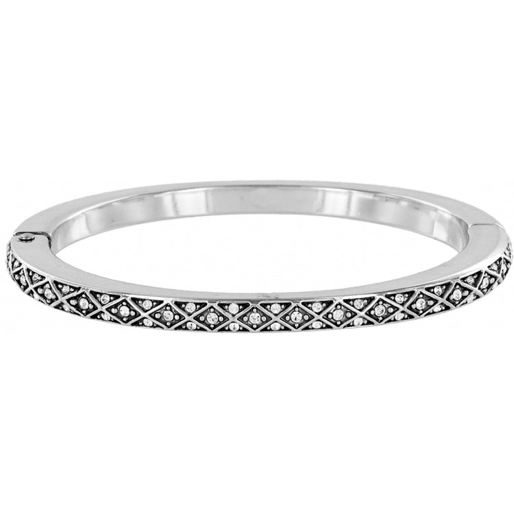 Silver plated diamond hinged bangle with fine-quality crystal accents in a geometric pattern.