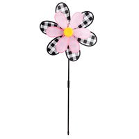 Flower Pinwheel Spinner wall decor in blue with white petals on a natural wood frame.