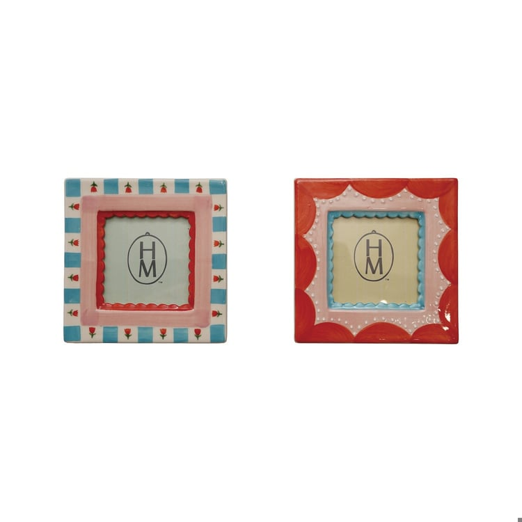 Two 4-1/2 inch square stoneware photo frames with colorful hand-painted patterns and scalloped edges