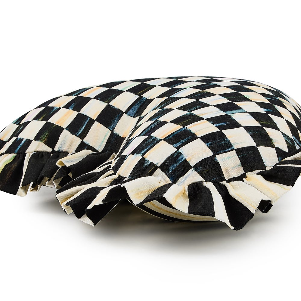 Heart-shaped throw pillow with a black and white checkered pattern and ruffled edges.