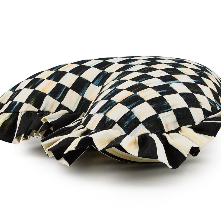 Heart-shaped throw pillow with a black and white checkered pattern and ruffled edges.