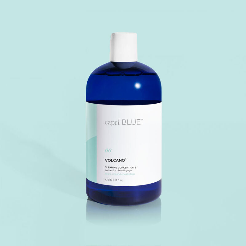 Bottle of Volcano Cleaning Concentrate in clear glass with a white label.