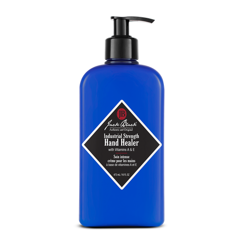 Industrial Strength Hand Healer hand cream in a white jar with black text.