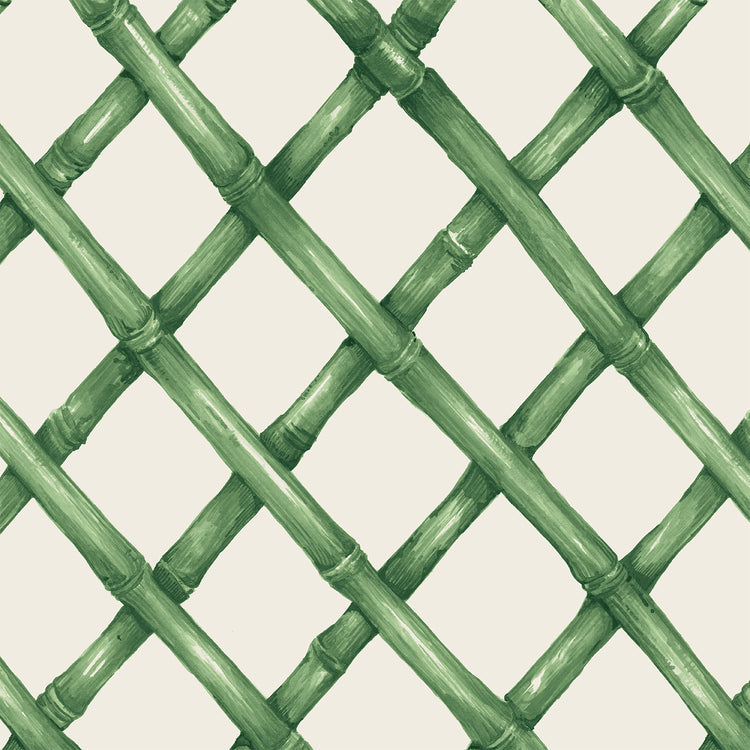 Cocktail napkin with a green bamboo lattice pattern on a cream background.