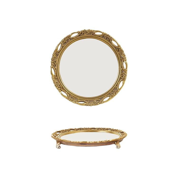 Round resin mirrored footed tray with an ornate gold-finished frame, shown from two angles.