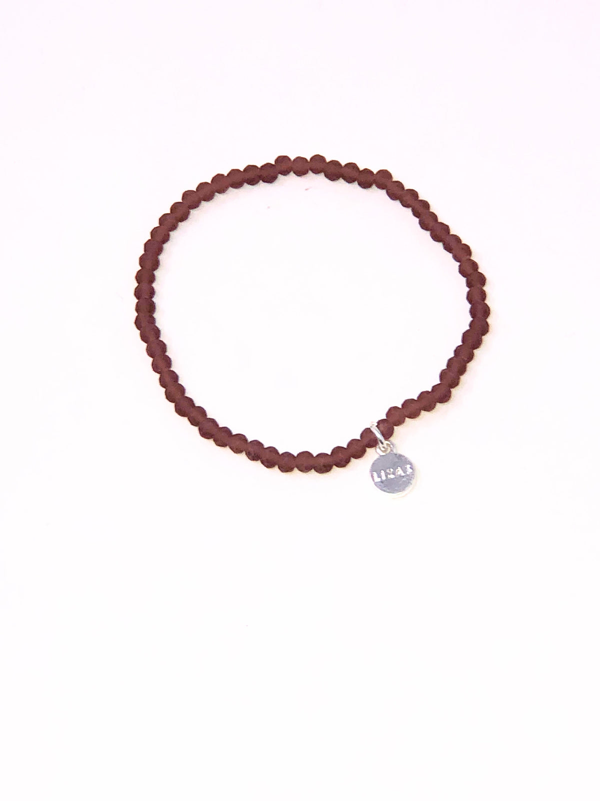 Stretchy beaded bracelet with faceted glass beads in a colorful pattern.