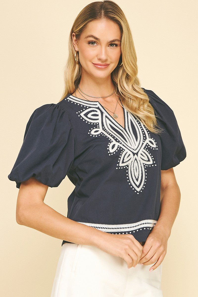 Gail embroidered detail balloon short sleeve V-neck blouse in white cotton with shirring.