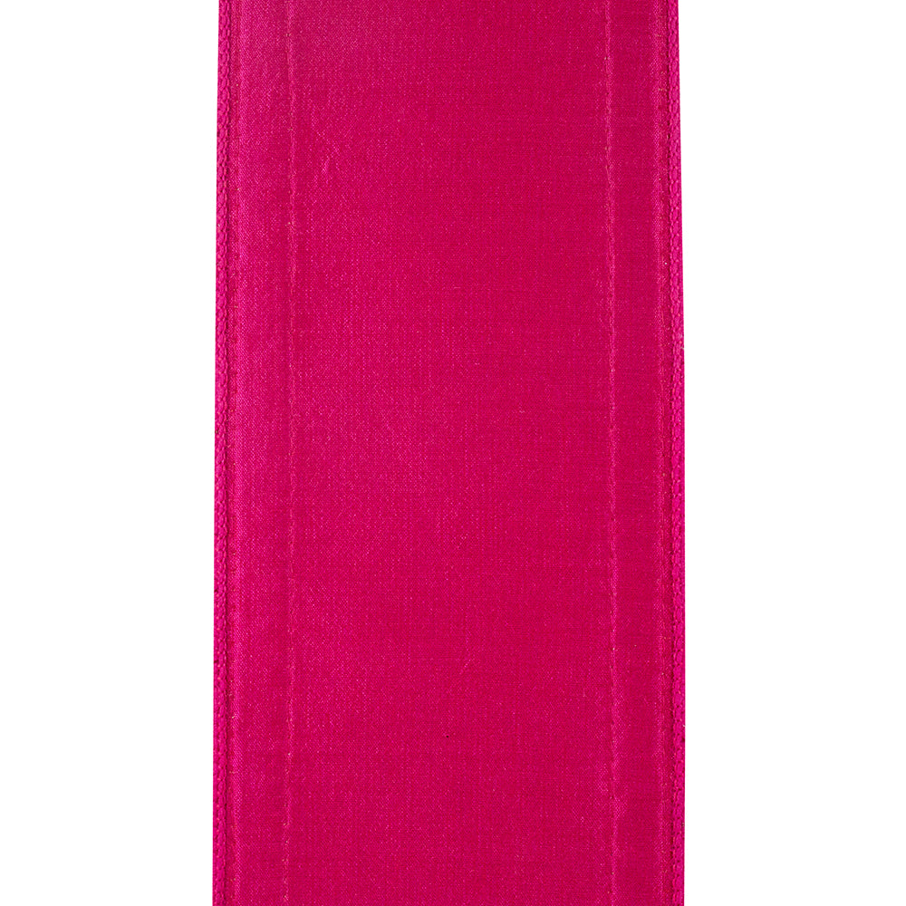 4 inch wide fuchsia wired edge ribbon with a multi-color braid texture.