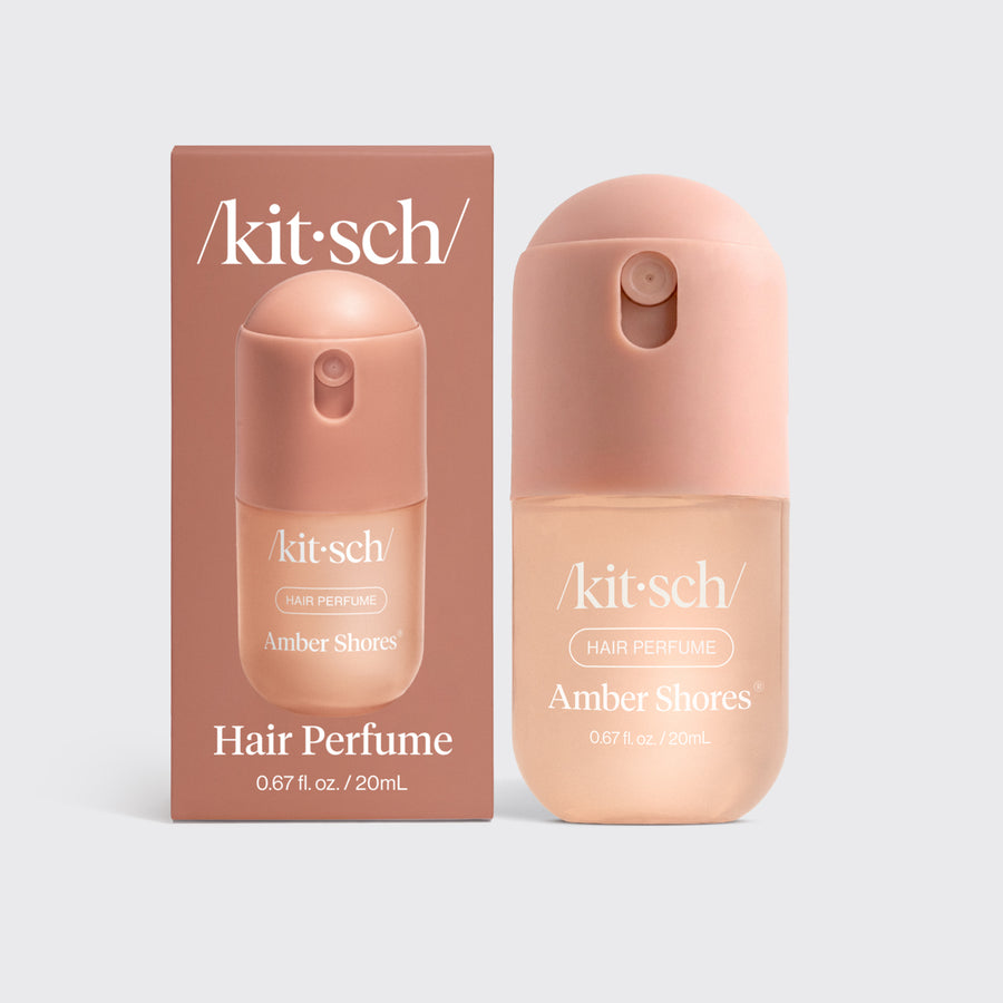 Mini Amber Shores Hair & Body Perfume Mist in a peach bottle next to its matching box.