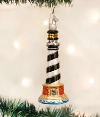 Cape Hatteras Lighthouse glass ornament with black and white spiral stripes on a Christmas tree.