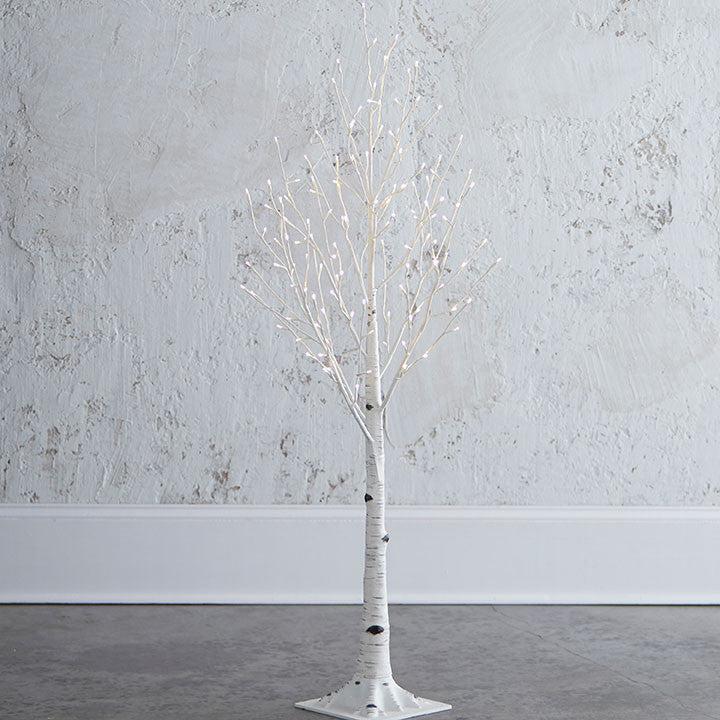 4.5' white lighted birch tree with 128 warm white LED lights on a square base.