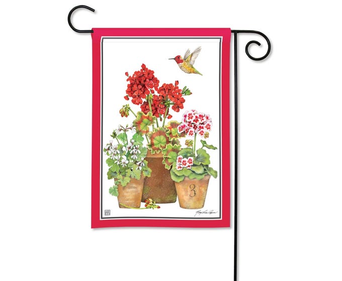 Garden flag with a red border featuring three potted geraniums and a hummingbird.