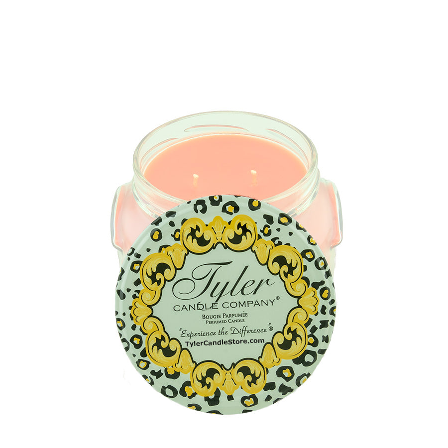 11oz Tyler Candle in a glass jar with a leopard print lid featuring gold ornate scrollwork.
