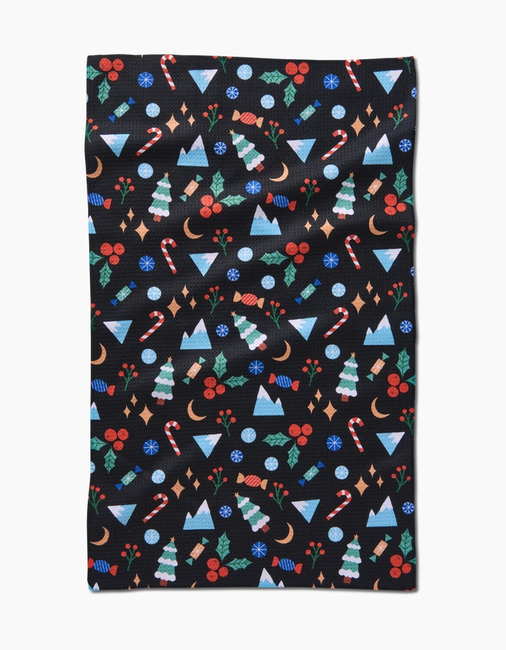 Holiday tea towel with waffle weave construction in red featuring a festive snowman silhouette.