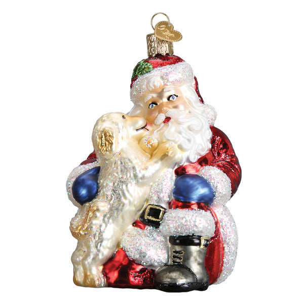 Hand-painted glass Christmas ornament featuring Santa Claus hugging a golden puppy.