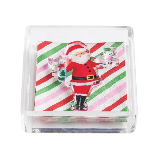Clear acrylic napkin holder with striped holiday napkins and a Santa Claus acrylic weight.