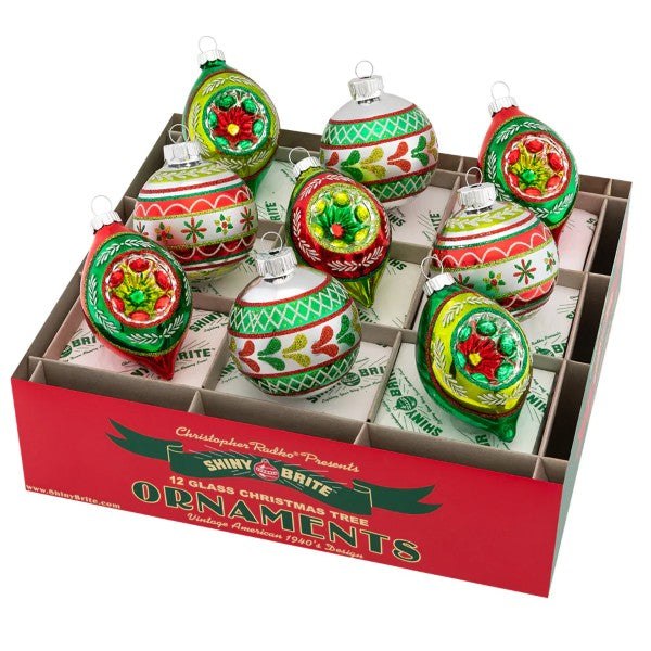 Set of nine mouth-blown glass round decor pieces with painted floral patterns in warm holiday colors.