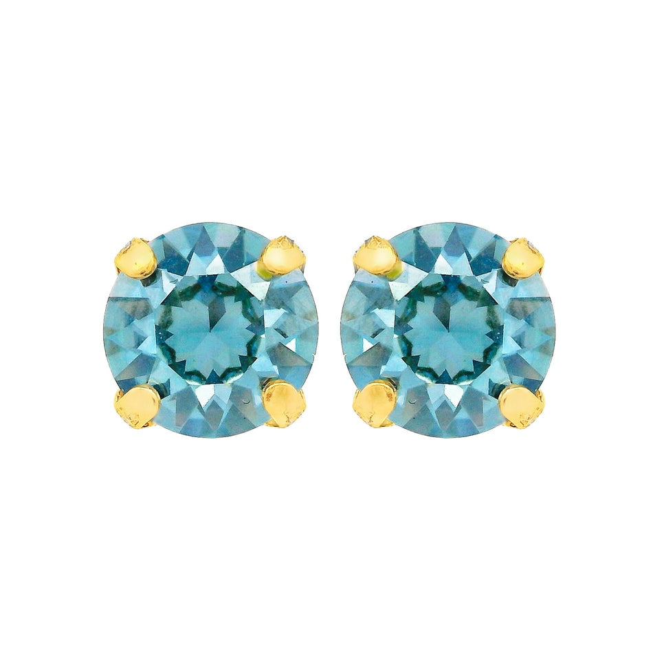 Oakland Studs in Aqua Bohemica featuring round blue crystals in four-prong gold settings.