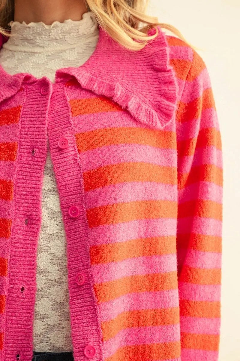 Mika pink and orange striped button-down cardigan with a ruffled collar and long sleeves.