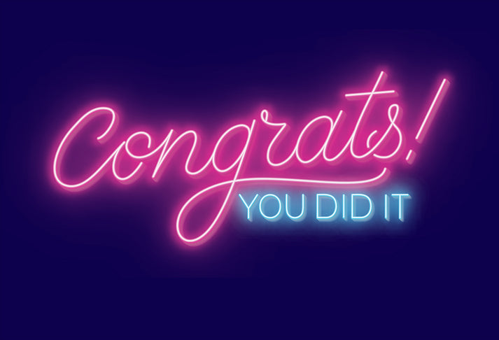 Neon sign reading 'Congrats! You Did It' with embossed text inside saying 'and you should be VERY PROUD'