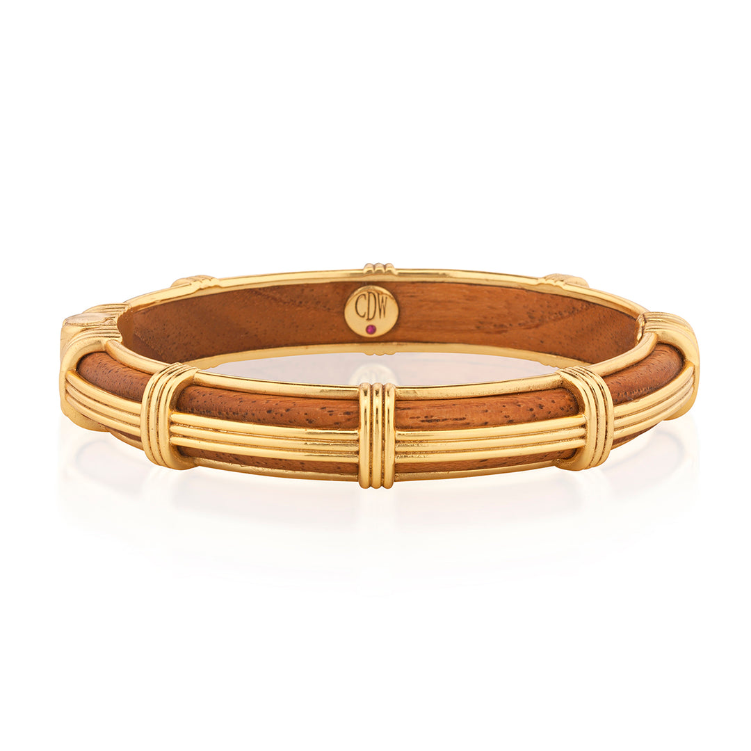 Gaia Petite Hinged Bangle in Teak with ribbed gold-tone metalwork and corded wrap accents.