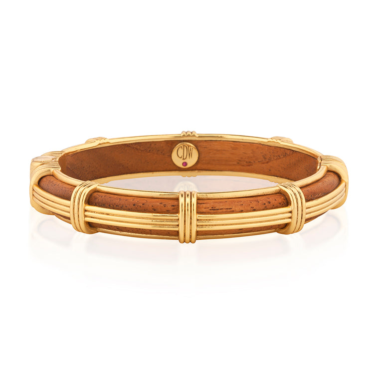 Gaia Petite Hinged Bangle in Teak with ribbed gold-tone metalwork and corded wrap accents.