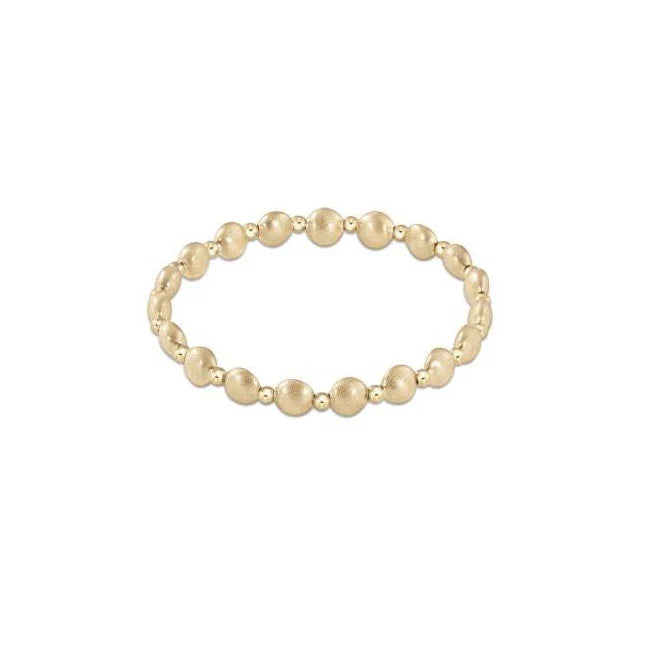Gold-colored honesty bracelet with a grateful geometric bead pattern on an adjustable chain.