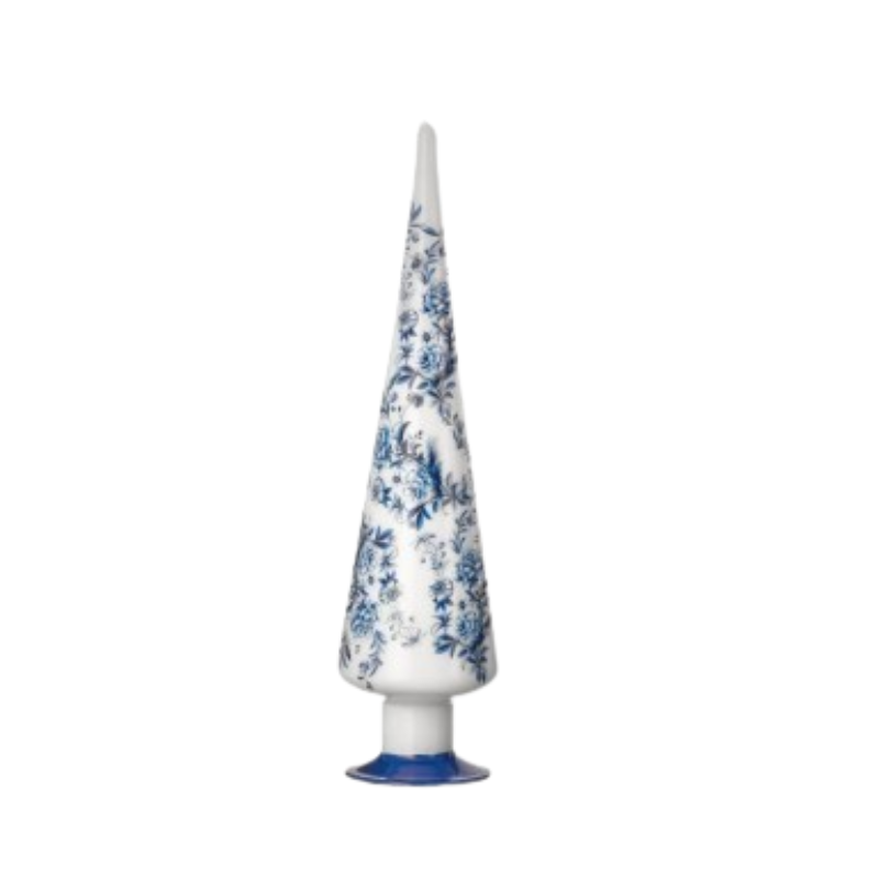 Conical white glass tree with blue floral patterns on a small blue base.