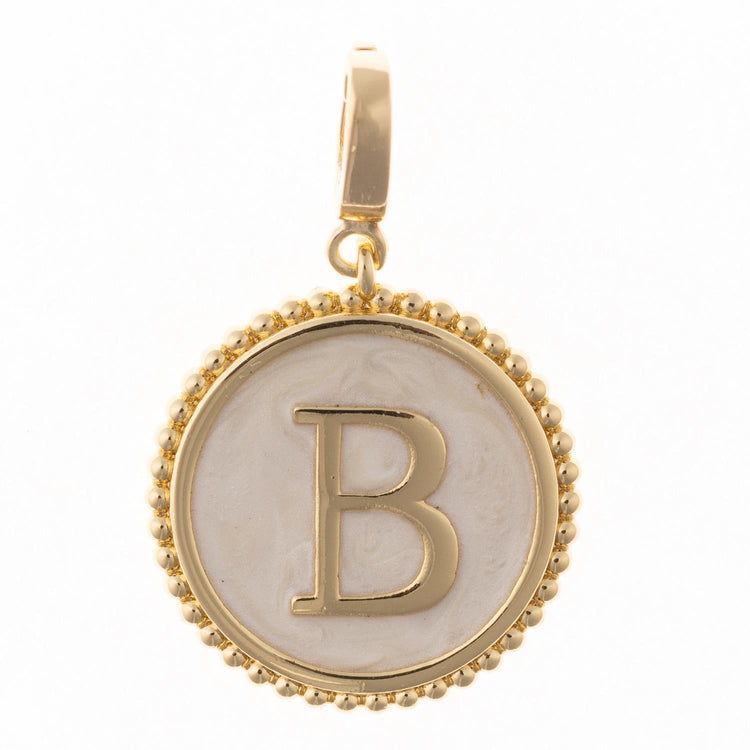 Circular .5-inch charm in 18k gold plating with faux mother-of-pearl inlay and clasp.