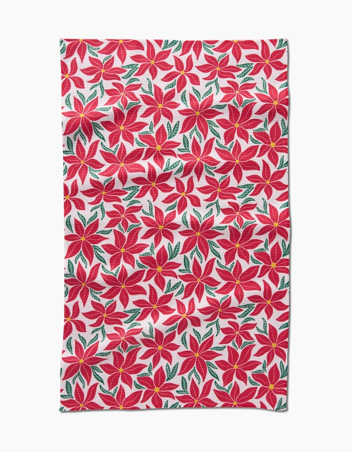 Holiday tea towel with waffle weave construction in red featuring a festive snowman pattern.