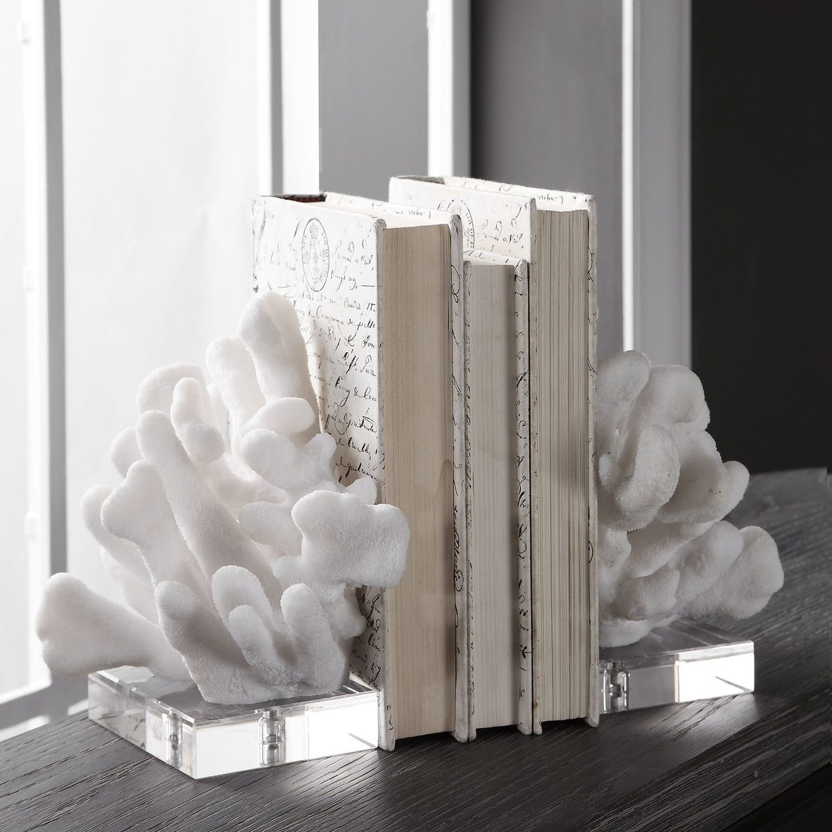 White Charbel bookends set featuring a clean geometric silhouette with smooth surfaces.
