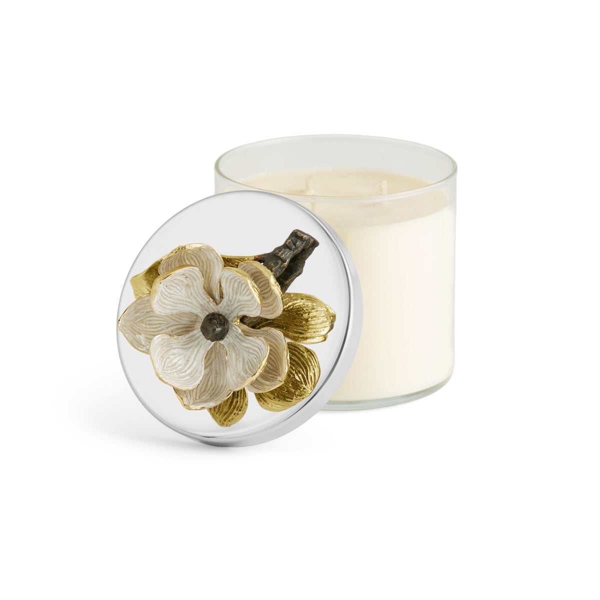 Antique goldtone glass candle holder with oxidized brass accents containing a triple-wick soy wax candle scented with magnolia and jasmine.