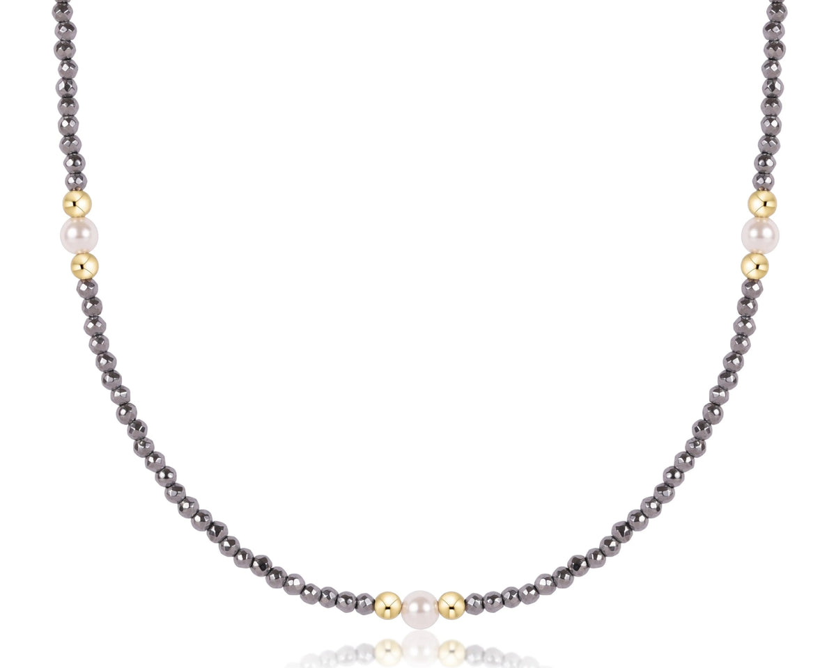 Choker with silver faceted hematite beads, 14kt gold-filled beads, and three 4mm pearl crystals.