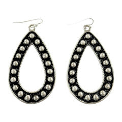 Vintage silver teardrop earrings with oxidized dark background and center cutout