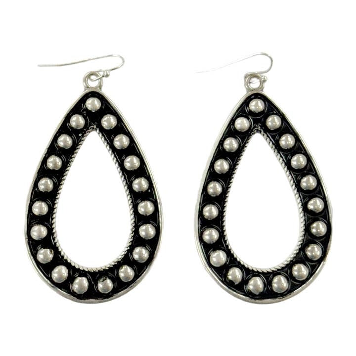 Silver bubble teardrop earrings with a black background and center cutout.