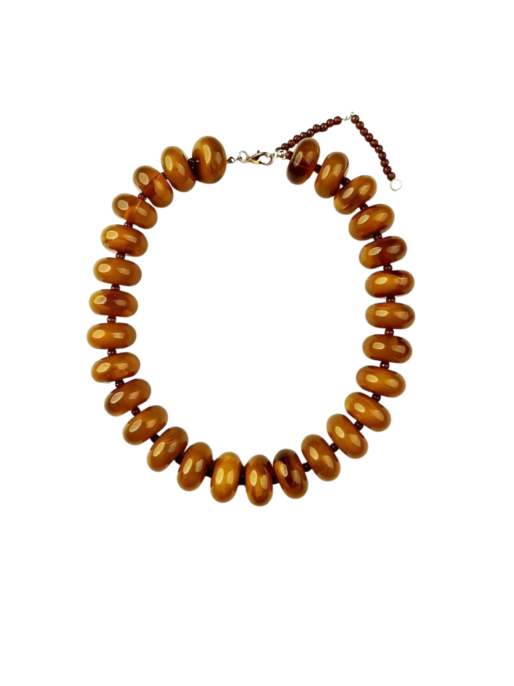 Bright acrylic gradient necklace with large amber-colored oval beads and a lobster clasp.