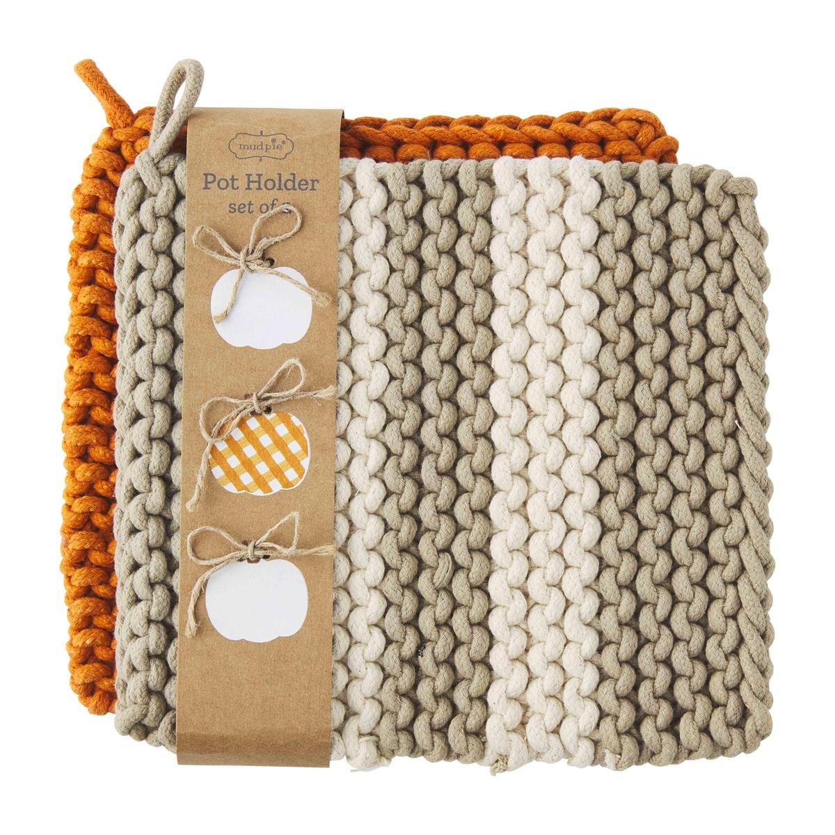 Square cotton crochet pot holder in natural beige with openwork lace pattern.