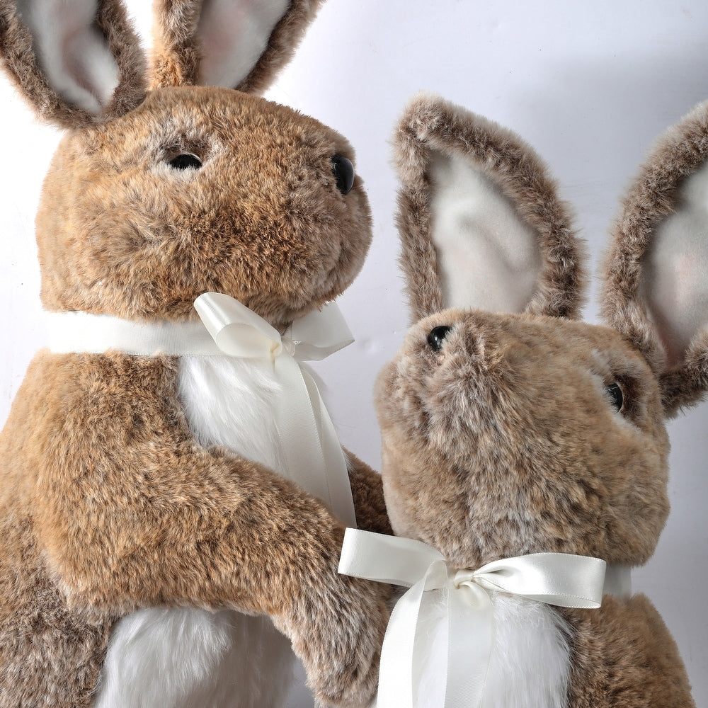 Standing faux fur bunny with bendable ears, realistic eyes, ribbon bow, measuring 22 inches tall.