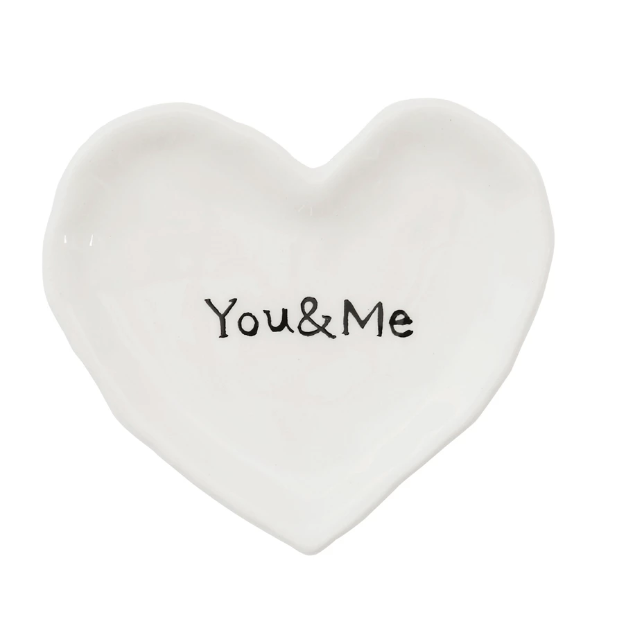 Ceramic heart-shaped dish in white with a subtle textured finish.