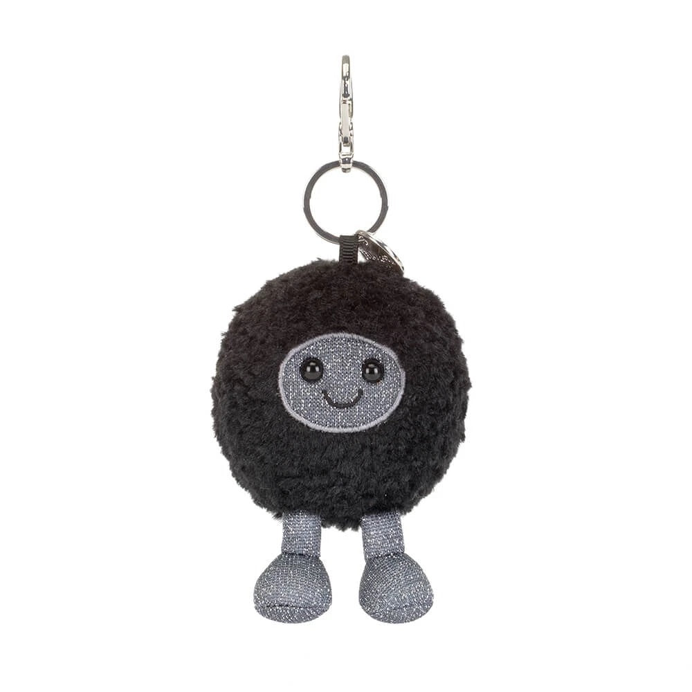 Amuseables Black Hole Bag Charm featuring a fuzzy black sphere with a smiling face and silver legs.